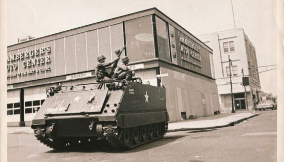 -Armored car stands guard and Academy and University Ave--min