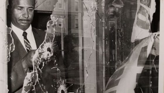Photo of Earl Harris Inspecting Damage to his Store (C-108)-min