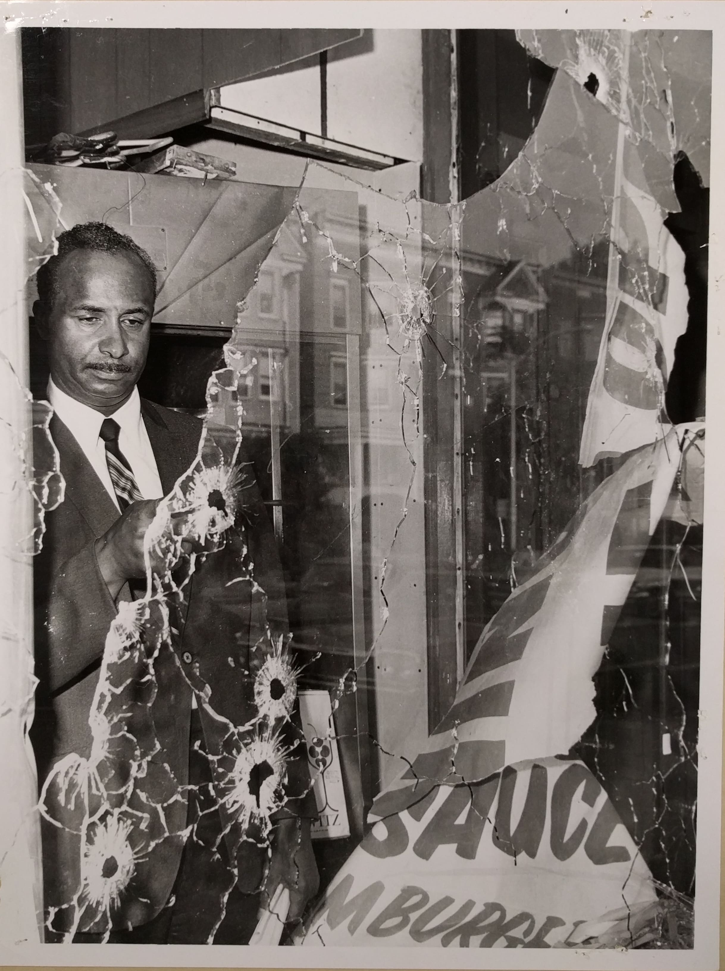 Photo of Earl Harris Inspecting Damage to his Store (C-108)-min